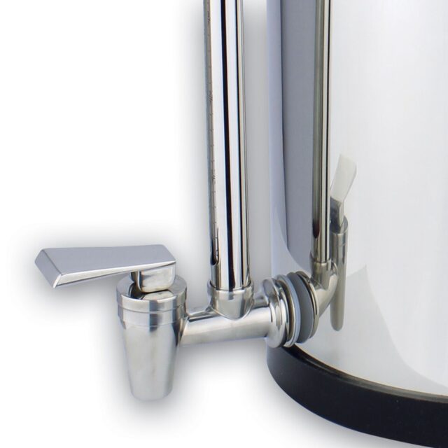 Close-up of the tap and stand of a water filter system.